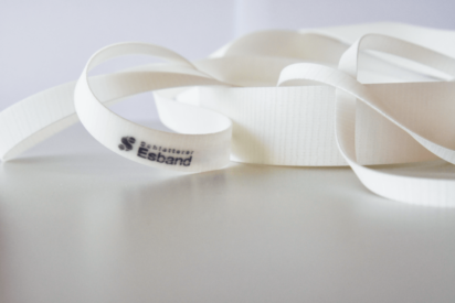 Close up of white tube winder belts lying on a table
